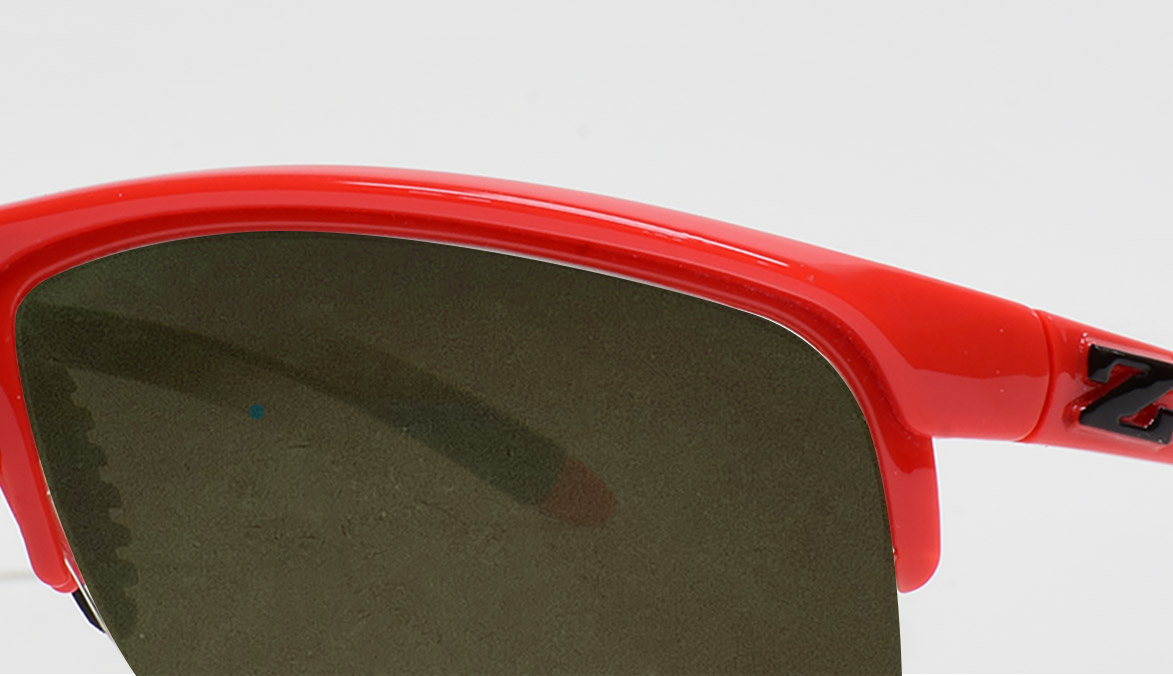 zoran-red-frame-graphite-green-lens
